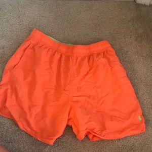 Orange Ralph Lauren swim trunks with green horse